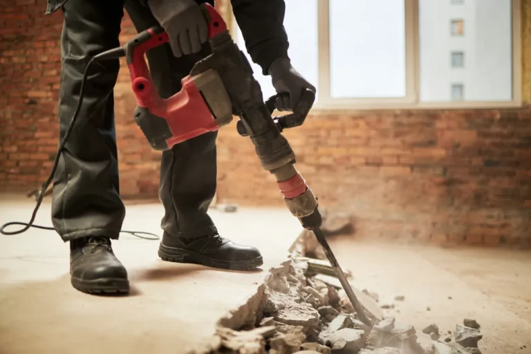 Demolition worker using a jackhammer